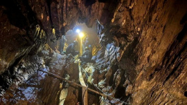 Rescuers work their way into the cave system in Xaisomboun, Laos. Photo: Reuters