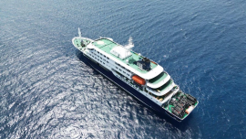 This aerial picture shows a general view of the cruise ship MV Hondius stationary off the port of Praia, the capital of Cape Verde, on May 4, 2026. AFP 