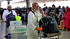 A Bangladeshi pilgrim arrives at Hazrat Shahjalal International Airport on Biman Bangladesh Airlines' first post-Hajj return flight from Saudi Arabia. Photo: Star