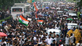 Supporters of the Cockroach Janta Party march toward parliament on the opening day of its monsoon session, demanding the resignation of Education Minister Dharmendra Pradhan over exam paper leaks, in New Delhi, India. Photo: Reuters