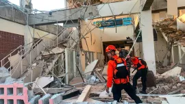 This handout picture taken and released on August 15, 2026 by Indonesia's National Search and Rescue Agency (BASARNAS) shows rescuers working amid the rubble of a damaged building after an earthquake in Maumere, East Nusa Tenggara. Photo: AFP