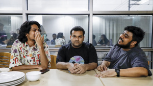 An introvert person is sitting in the middle of two extroverts