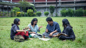 Four friends discussing things on campus