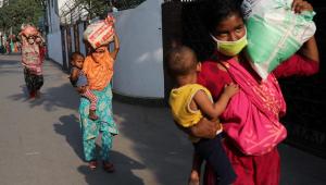 Women's unpaid care work Covid Reuters